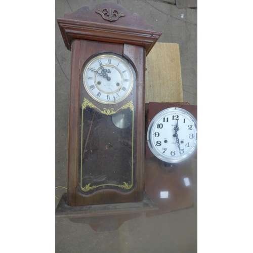 2307 - A dark wood cased clock with second clock face and movement