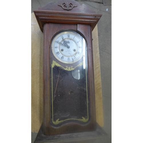 2307 - A dark wood cased clock with second clock face and movement