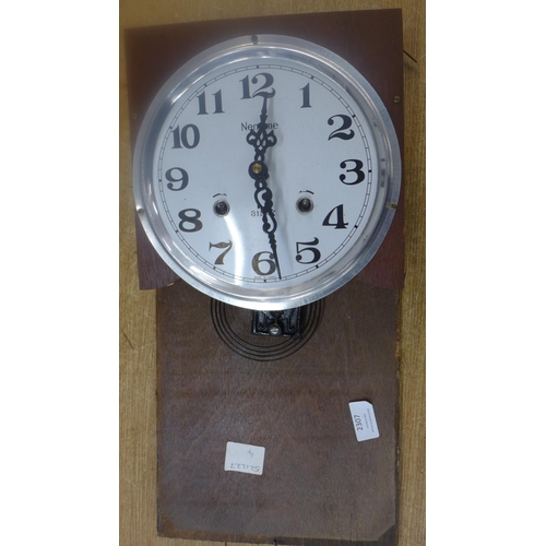 2307 - A dark wood cased clock with second clock face and movement