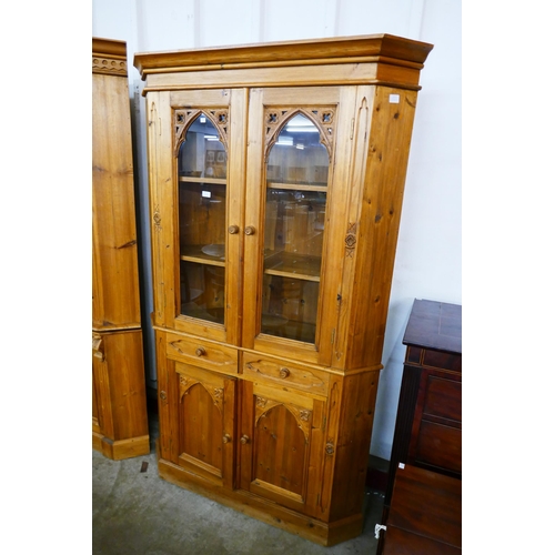 142 - A Victorian style carved pine freestanding corner cabinet