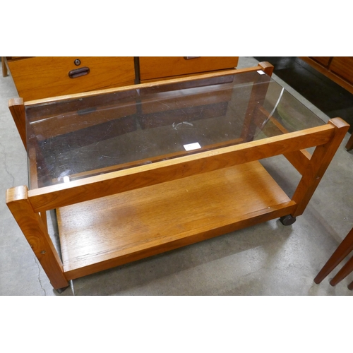 56A - A teak and glass topped rectangular coffee table and a record cabinet