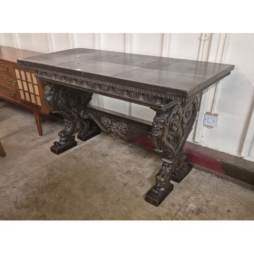 155A - A Venetian Rococo Revival carved walnut console table