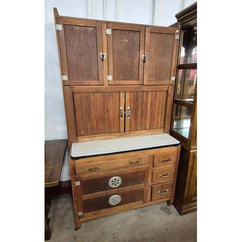 140 - An oak kitchen cabinet