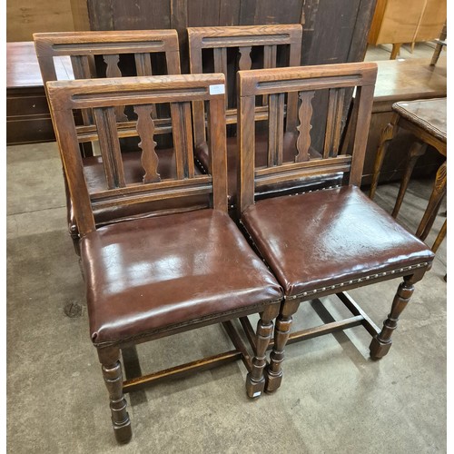 159 - A set of four early 20th Century oak and red leather dining chairs