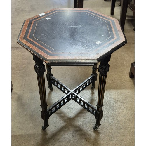 160 - A Victorian Aesthetic Movement ebonised and amboyna octagonal occasional table