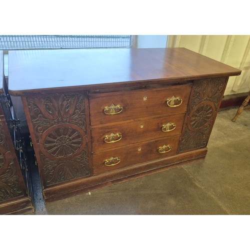 171 - A pair of Victorian Aesthetic Movement carved walnut estate cupboards