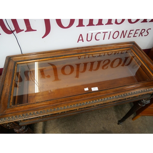 100 - A French style carved hardwood bijouterie table