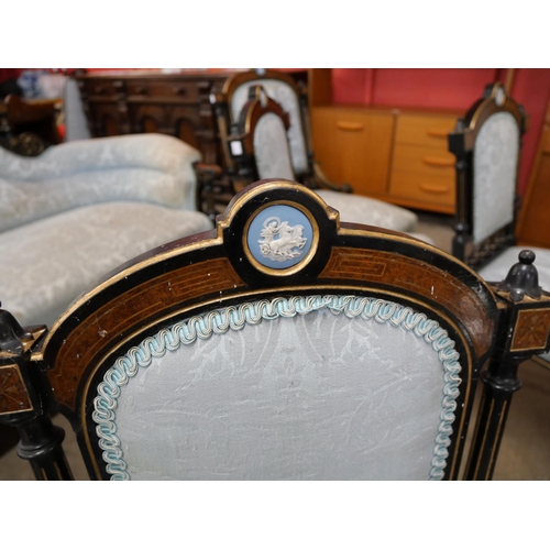 108 - A Victorian ebonised, amboyna and blue fabric upholstered seven piece salon suite, set with Wedgwood... 