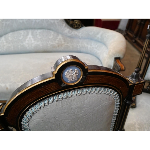 108 - A Victorian ebonised, amboyna and blue fabric upholstered seven piece salon suite, set with Wedgwood... 