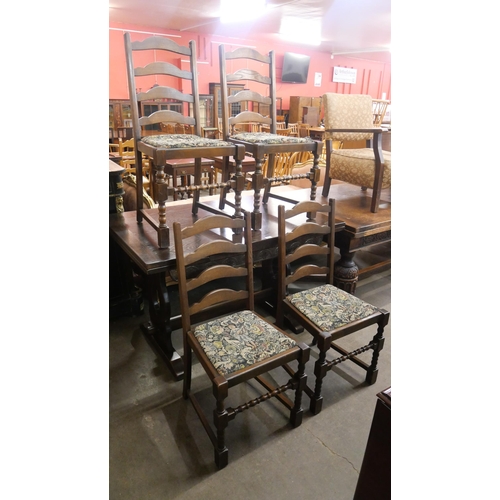 146 - An oak extending dining table and a set of four chairs