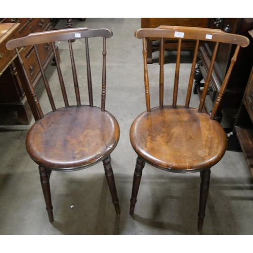 192 - A pair of Victorian beech penny seat kitchen chairs