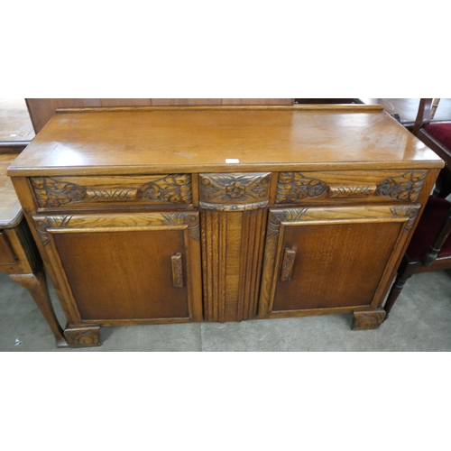 207 - An Art Deco carved oak sideboard