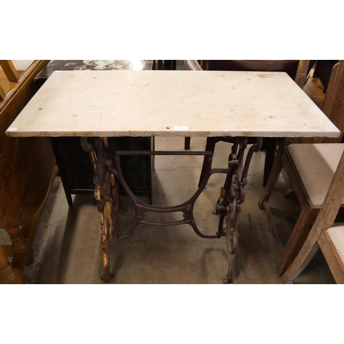 259 - A cast iron and marble topped rectangular garden table