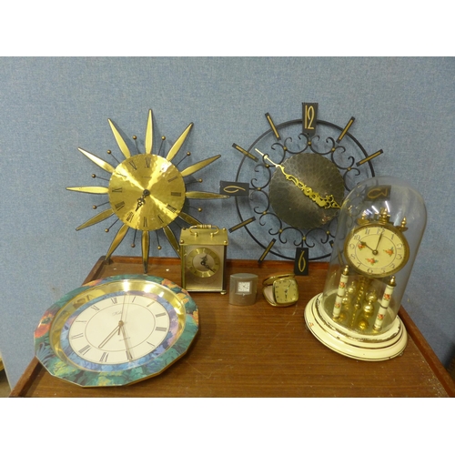 331 - Assorted clocks, including a domed clock, wall clocks, a travel clock, etc.