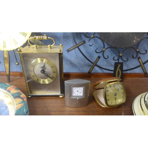 331 - Assorted clocks, including a domed clock, wall clocks, a travel clock, etc.