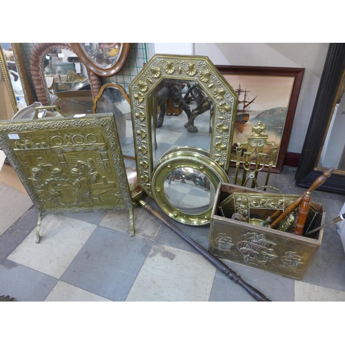 349 - A brass fire screen, an embossed brass framed mirror, bed warming pans, etc.