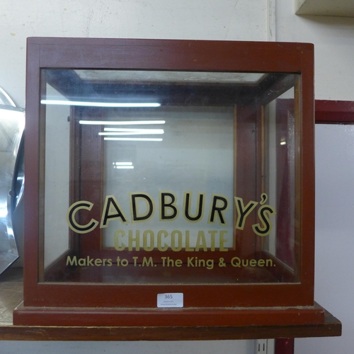 365 - A mahogany counter top shop display cabinet, bearing Cadburys inscription