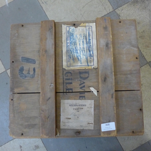 368 - A wooden box with various shipping labels, including Malayan, Rotterdam, Southampton, etc., and a co... 