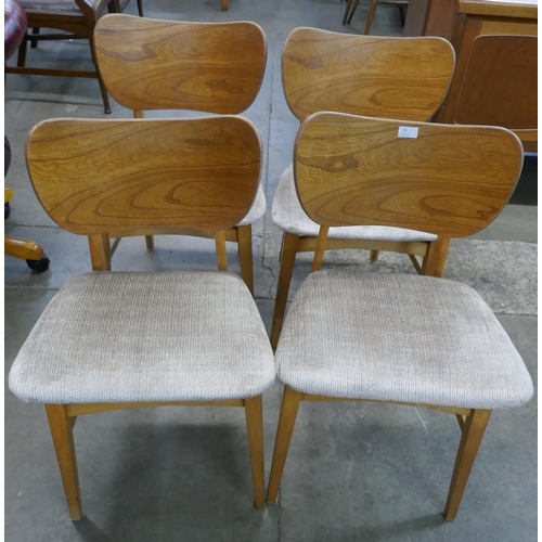 40 - A set of four Beautility teak and elm dining chairs