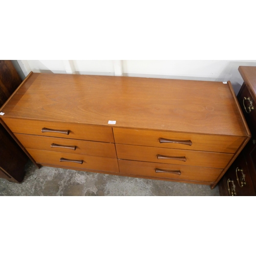 53 - A teak chest of drawers