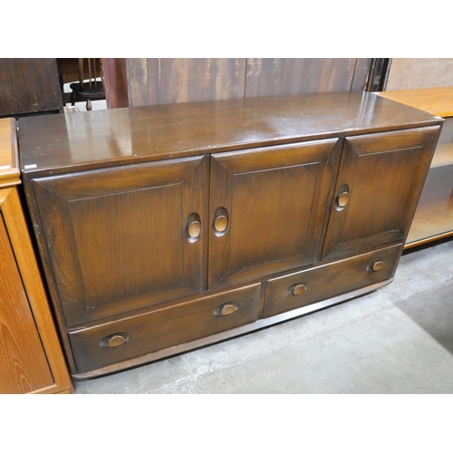 61A - An Ercol Golden Dawn elm Windsor sideboard