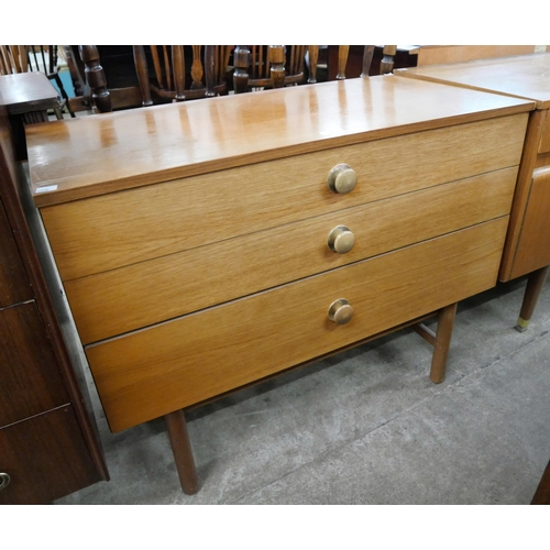 67 - A teak chest of drawers