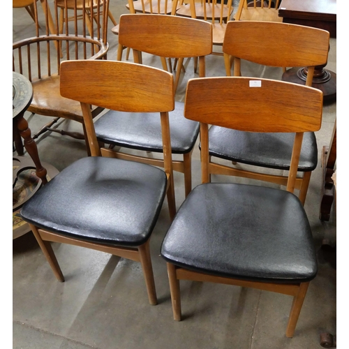 71 - A set of four teak dining chairs