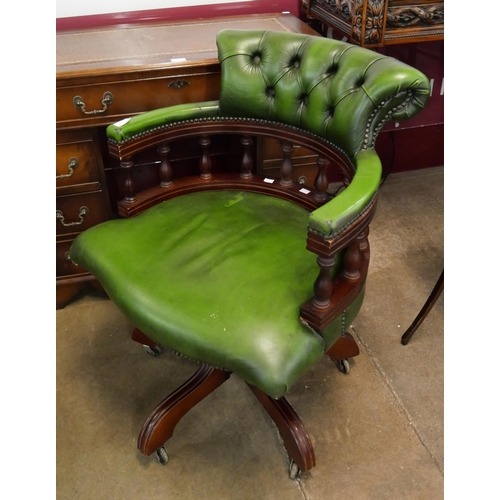 98 - A mahogany and green leather Captains revolving desk chair