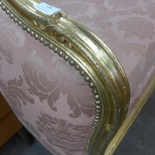130 - A French Louis XV style giltwood and fabric upholstered day bed