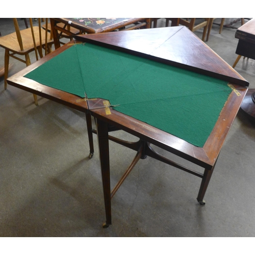 132 - An Edward VII inlaid mahogany envelope games table