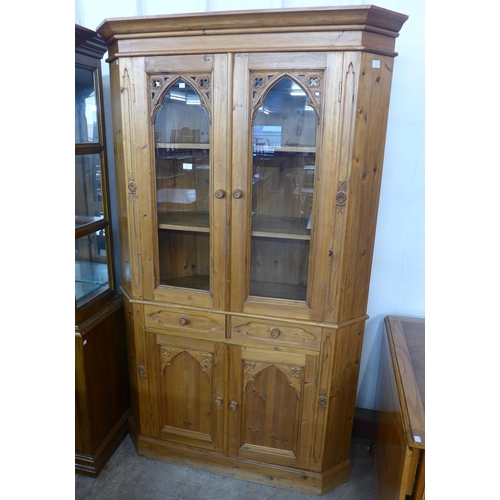 142 - A Victorian style carved pine freestanding corner cabinet