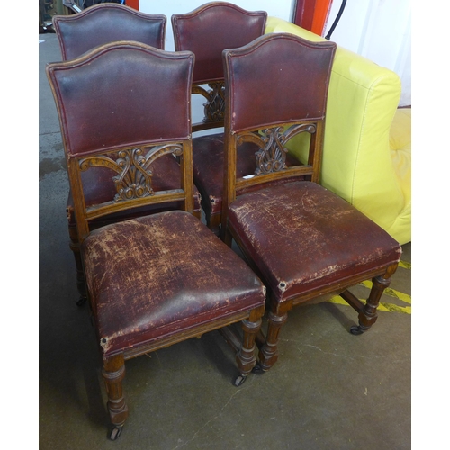 145 - A set of four Victorian carved oak dining chairs