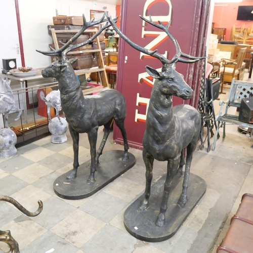 598 - A pair of large cast iron garden figures of stags