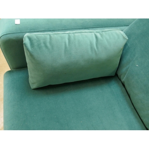 1302 - A turqouise velvet three seater sofa