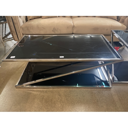 1312 - A black glass and chrome coffee table and lamp table * this lot is subject to VAT