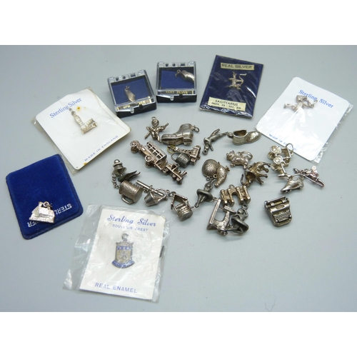 1017 - A collection of silver and white metal charms