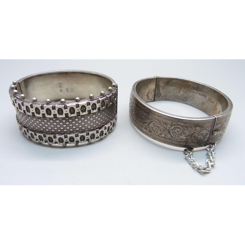 1023 - A Victorian silver bangle, Birmingham 1883, Robert James Dick, and one other silver bangle, Chester ... 