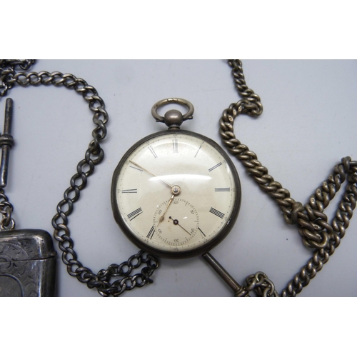 1024 - A silver fusee pocket watch with diamond end stone, a silver vesta case on a silver chain and a silv... 