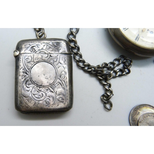 1024 - A silver fusee pocket watch with diamond end stone, a silver vesta case on a silver chain and a silv... 