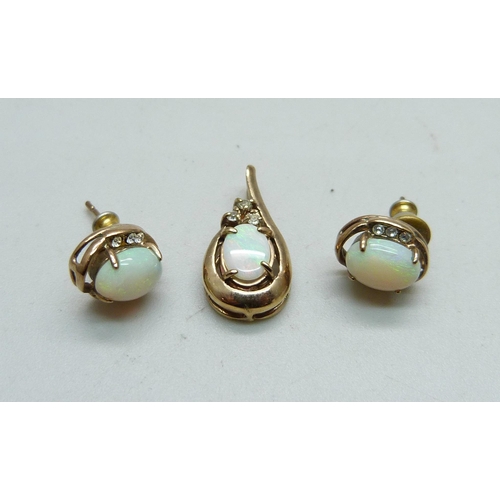 1036 - A yellow metal and opal pendant and a pair of matching earrings, 3g