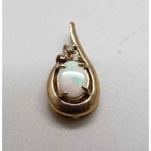 1036 - A yellow metal and opal pendant and a pair of matching earrings, 3g