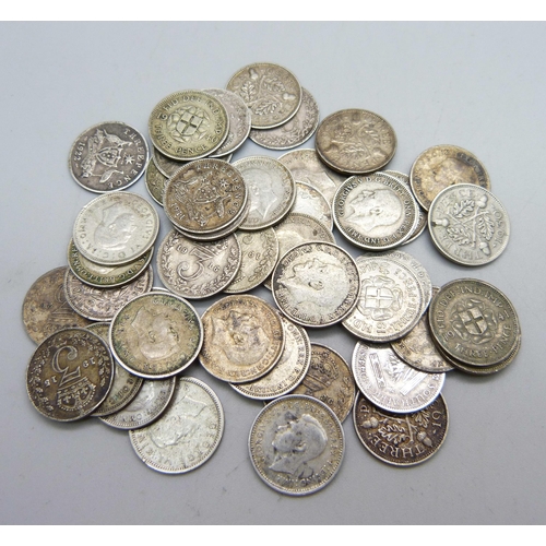 1040 - A collection of silver 3d coins, 60g