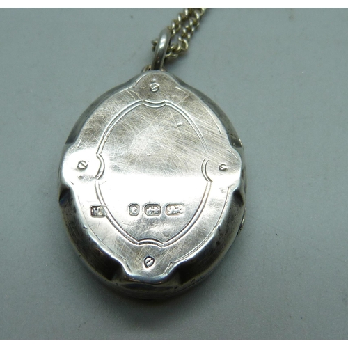 1043 - A Victorian silver AEI locket (Amity, Eternity, Infinity), Birmingham 1879, on a silver chain