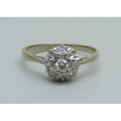 1047 - An 18ct white gold and diamond cluster ring, mark worn, 3.1g, P/Q