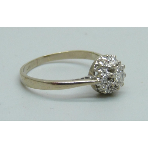 1047 - An 18ct white gold and diamond cluster ring, mark worn, 3.1g, P/Q