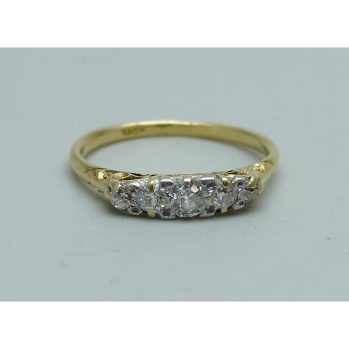 1050 - An 18ct gold and five stone diamond ring, approximately 0.5ct weight, 2.8g, Q