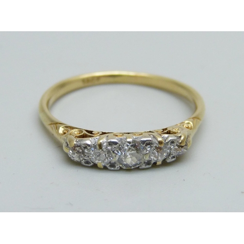 1050 - An 18ct gold and five stone diamond ring, approximately 0.5ct weight, 2.8g, Q