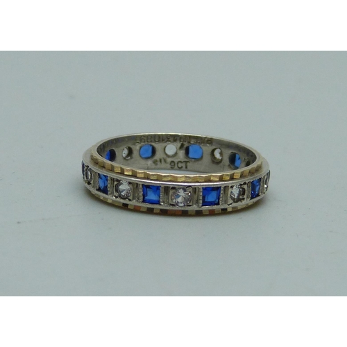 1051 - A 9ct gold and silver eternity ring, L