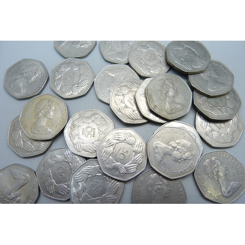 1085 - Twenty-four 50p pieces, 1973