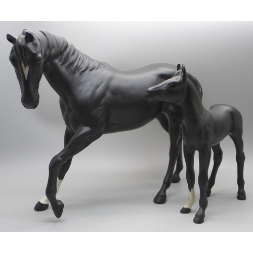 613 - A Beswick Black Beauty and foal (matt)